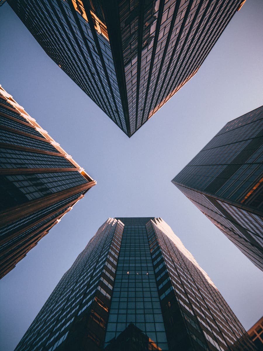 Office towers seen looking straight up from street level